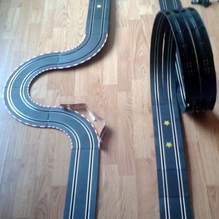 Here's one of the tracks we've built. This one is not as advanced, but very fun to race, especially due to the loop you see back there. There are two lanes, so that we can do two-player mode. This is great fun. :) (photo by Old School Game Blog)
