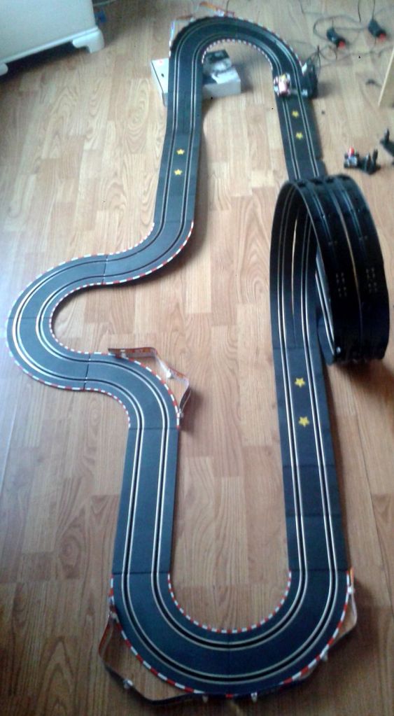 Here's one of the tracks we've built. This one is not as advanced, but very fun to race, especially due to the loop you see back there. There are two lanes, so that we can do two-player mode. This is great fun. :) (photo by Old School Game Blog)