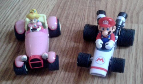 Here are the karts. My daughter loves driving the pink one with Princess, while I'm racing with Mario. It is possible to buy more cars and extensions. (photo by Old School Game Blog)